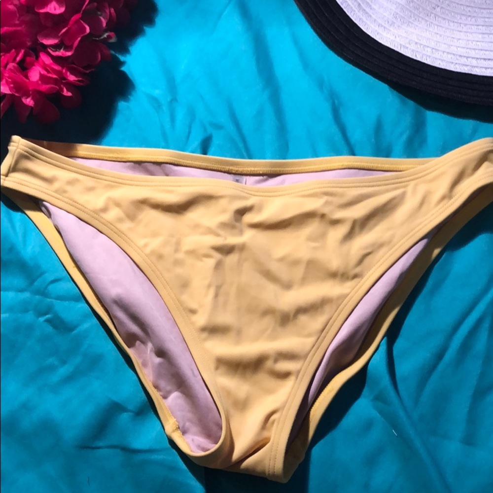 Yellow Victoria’s Secret bathing suit bottoms